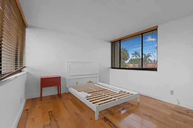 a bathroom with a sink mirror vanity and toilet