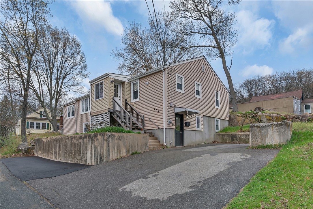 204 Talcott Street Woonsocket, RI 02895 - Photo 35 of 43 Driveway and front paved section with parking for 5 - 6 cars