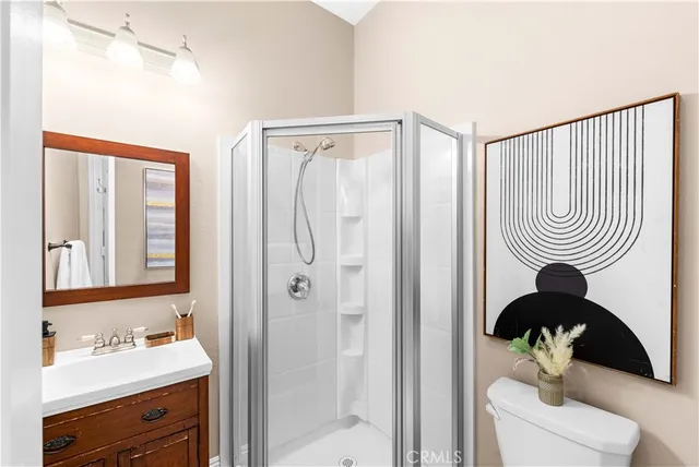 a bathroom with a sink a mirror and a shower