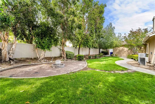 a view of a backyard with a garden and plants