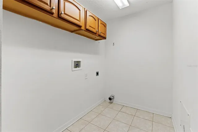 a view of an house with backyard and tree