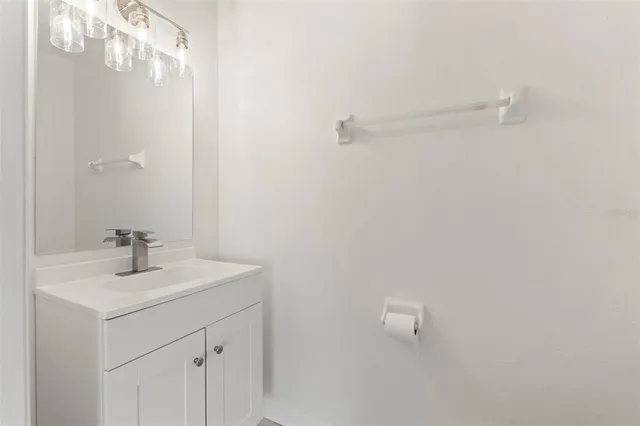 a bathroom with a sink a mirror and shower