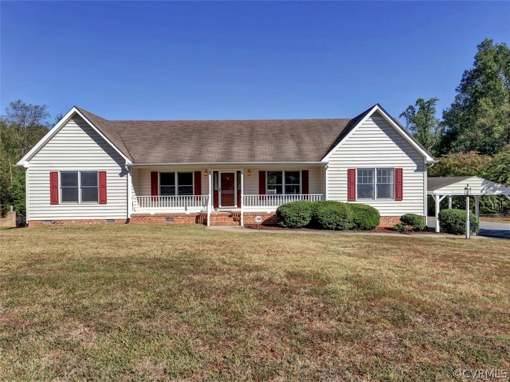 7936 Concho Road North Chesterfield, VA 23237 - Photo 1 of 24 a front view of a house with a garden