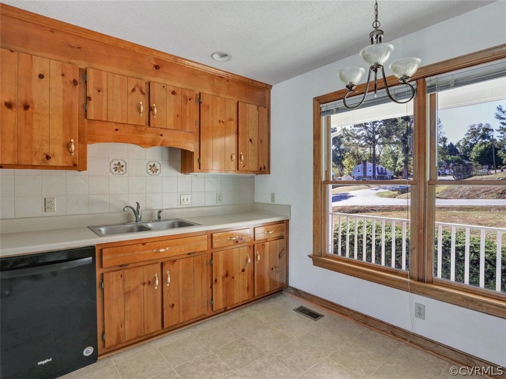 7936 Concho Road North Chesterfield, VA 23237 - Photo 11 of 24 a kitchen with sink cabinets and window