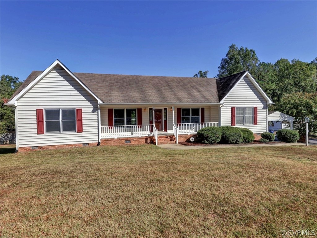 7936 Concho Road North Chesterfield, VA 23237 - Photo 2 of 24 a front view of a house with a garden