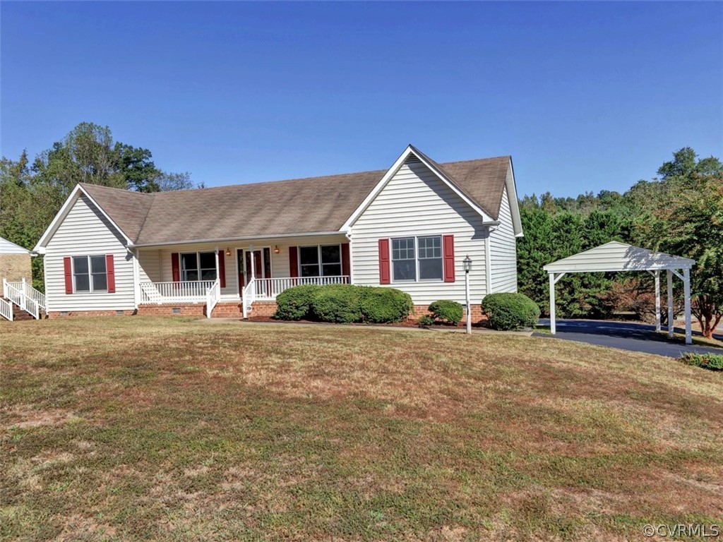7936 Concho Road North Chesterfield, VA 23237 - Photo 3 of 24 a front view of a house with a garden
