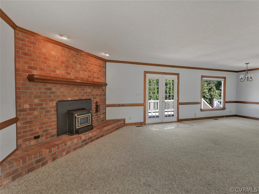 7936 Concho Road North Chesterfield, VA 23237 - Photo 6 of 24 a view of a livingroom with an empty space and a fireplace