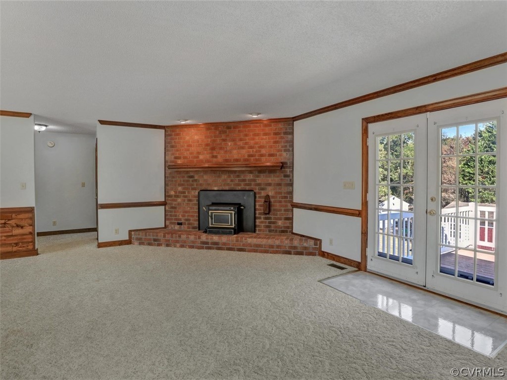 7936 Concho Road North Chesterfield, VA 23237 - Photo 7 of 24 an empty room with furniture and a fireplace