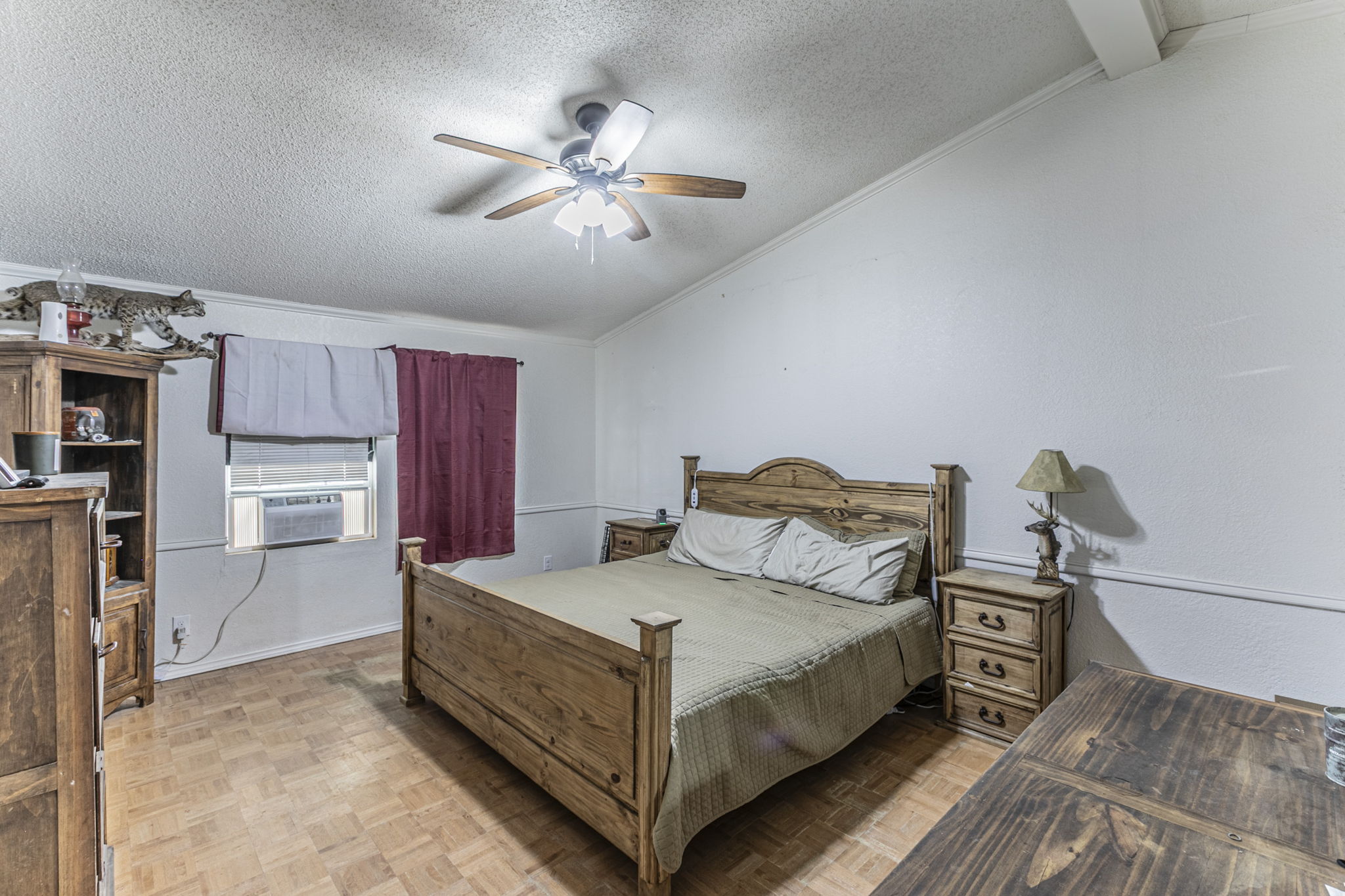 1767 Dowdy Road Seguin, TX 78155 - Photo 12 of 25 a bedroom with a bed and a chandelier
