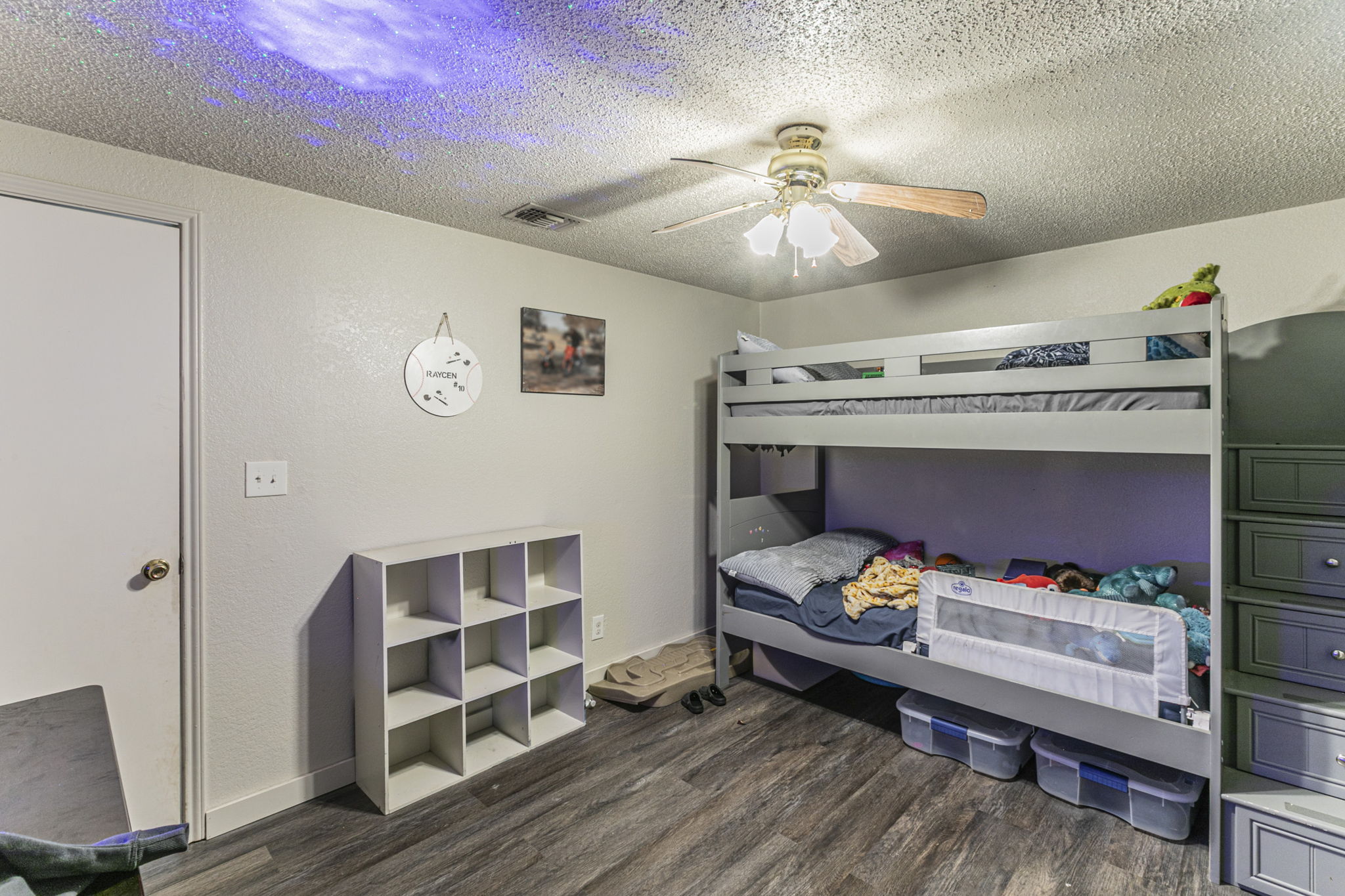 1767 Dowdy Road Seguin, TX 78155 - Photo 18 of 25 a bedroom with furniture and a chandelier
