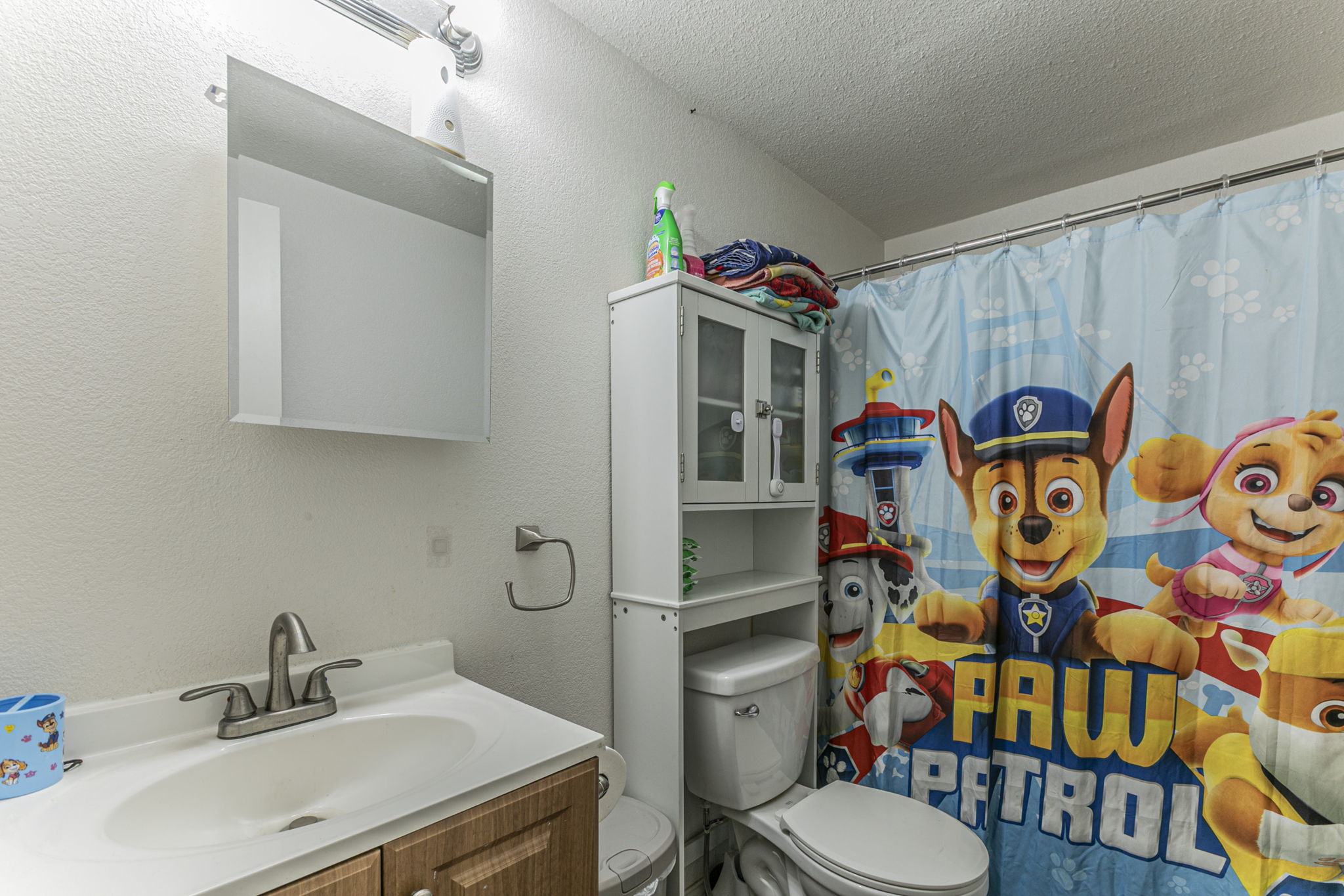 1767 Dowdy Road Seguin, TX 78155 - Photo 19 of 25 a bathroom with a sink toilet and shower curtain