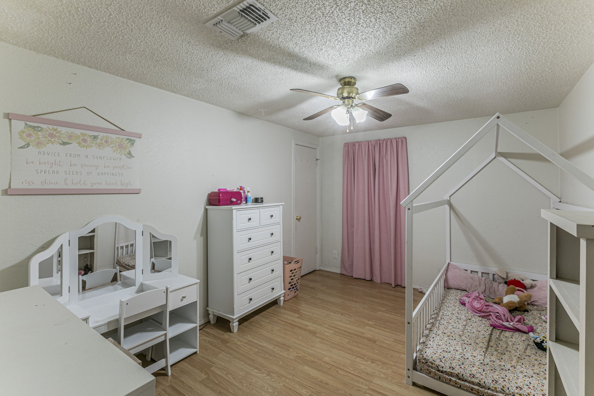 1767 Dowdy Road Seguin, TX 78155 - Photo 20 of 25 a bedroom with a bed and wooden floor