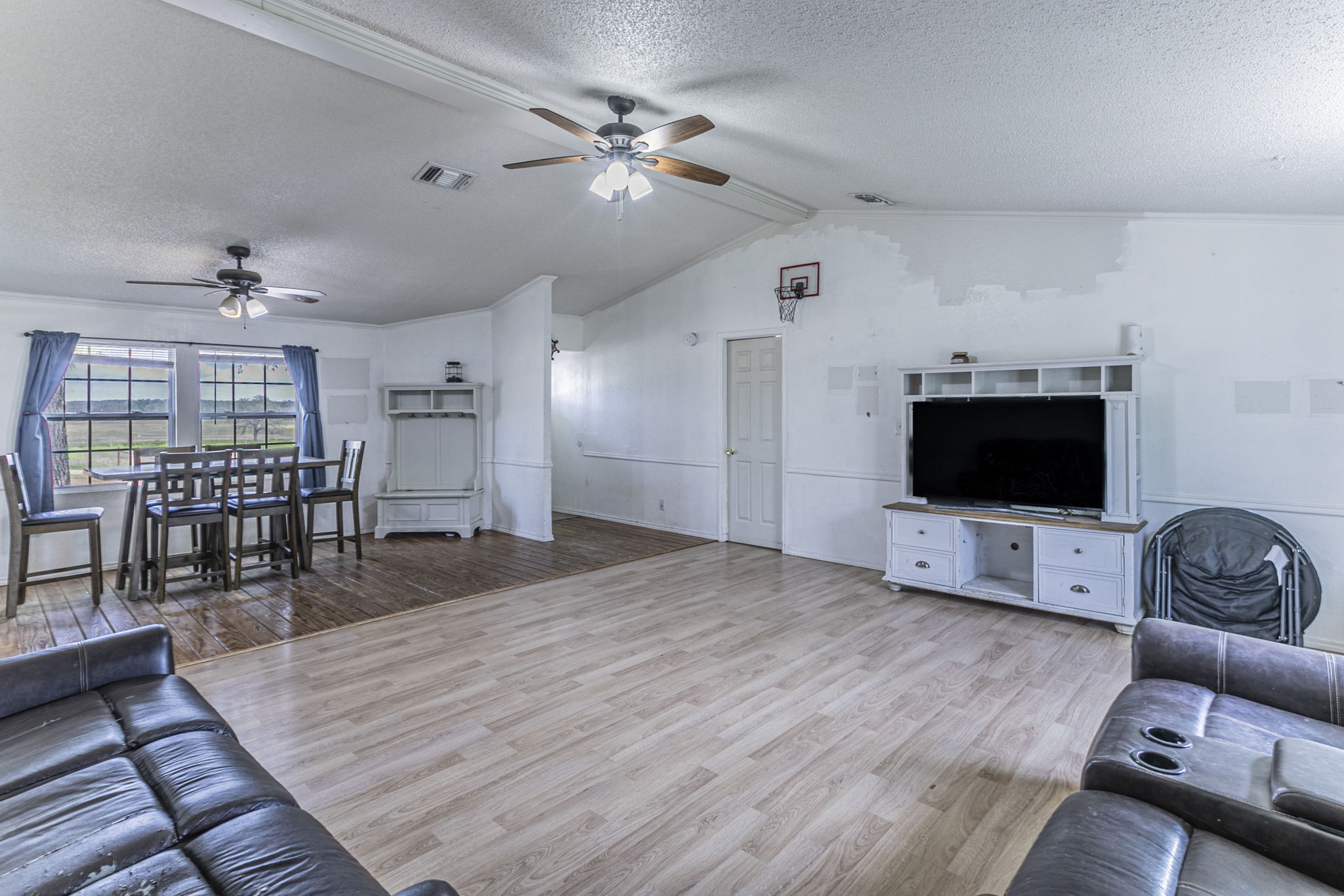 1767 Dowdy Road Seguin, TX 78155 - Photo 6 of 25 a living room with furniture and a flat screen tv