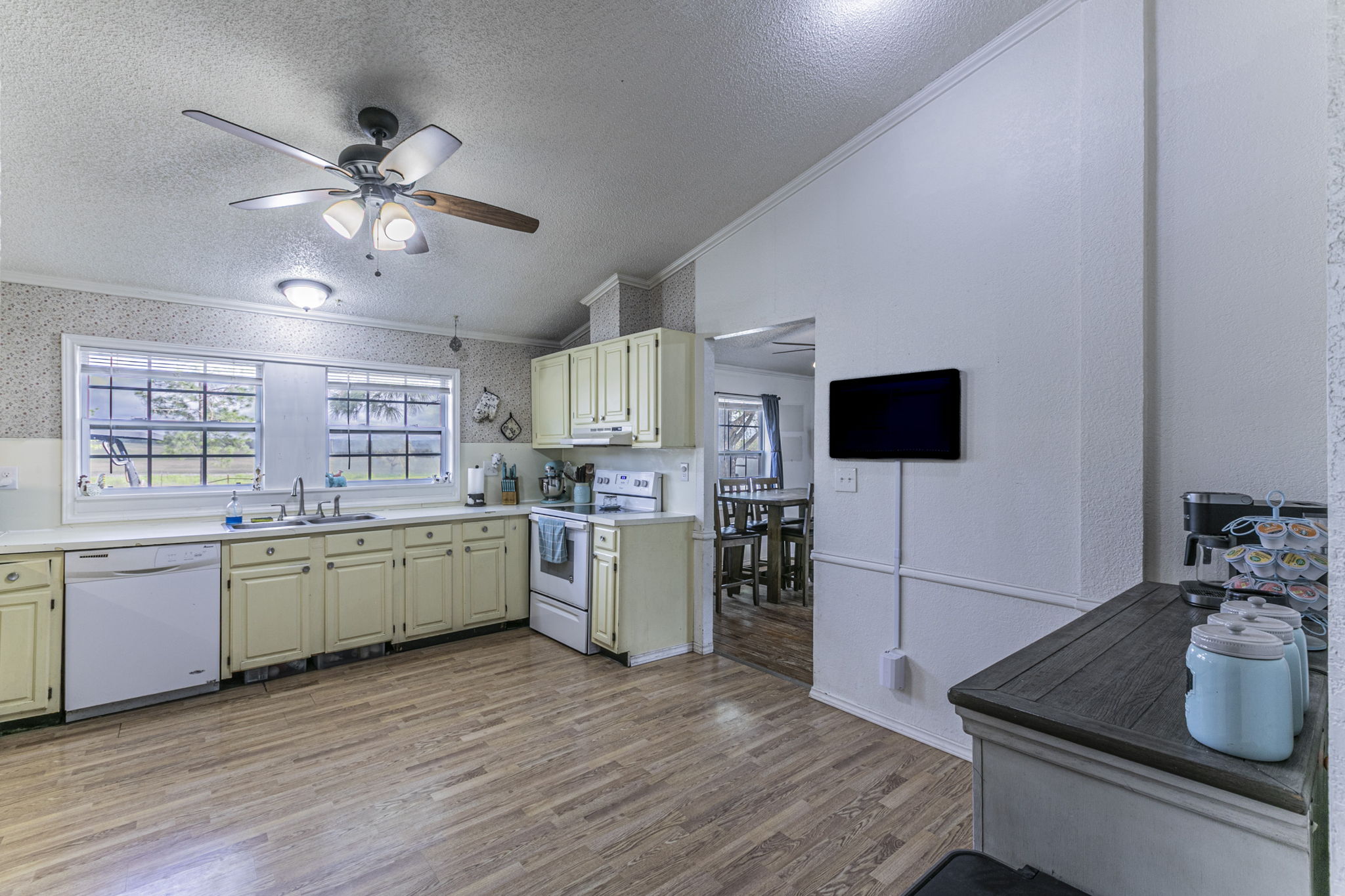 1767 Dowdy Road Seguin, TX 78155 - Photo 8 of 25 a kitchen with a sink cabinets and wooden floor