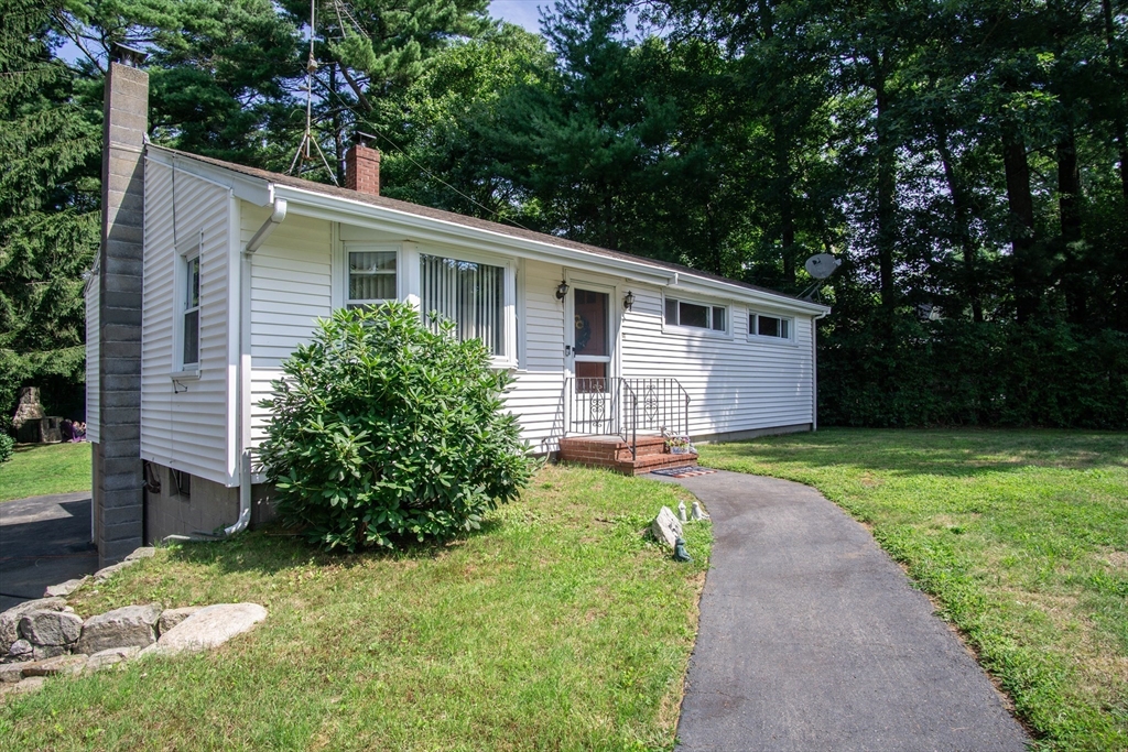 56 Chace Road East Freetown, MA 02717 - Photo 3 of 39 a front view of house with yard and green space