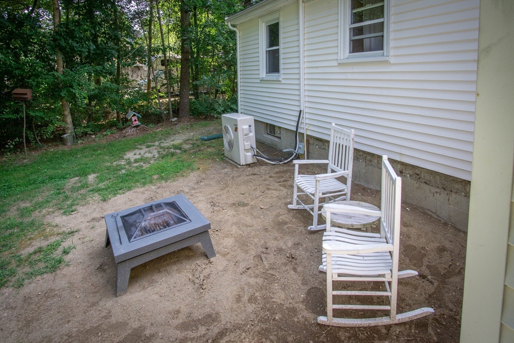 56 Chace Road East Freetown, MA 02717 - Photo 35 of 39 a backyard of a house with wooden floor and fence