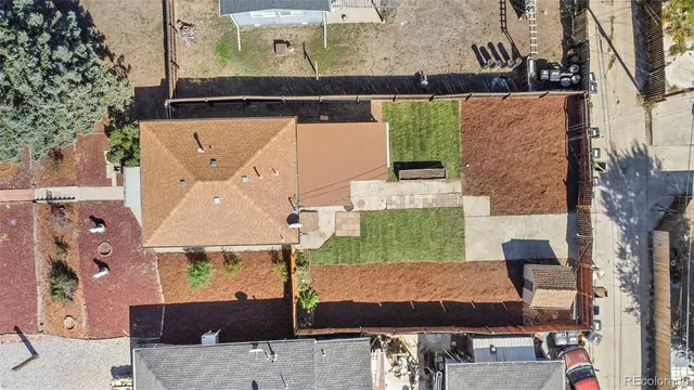 an aerial view of a house with a yard