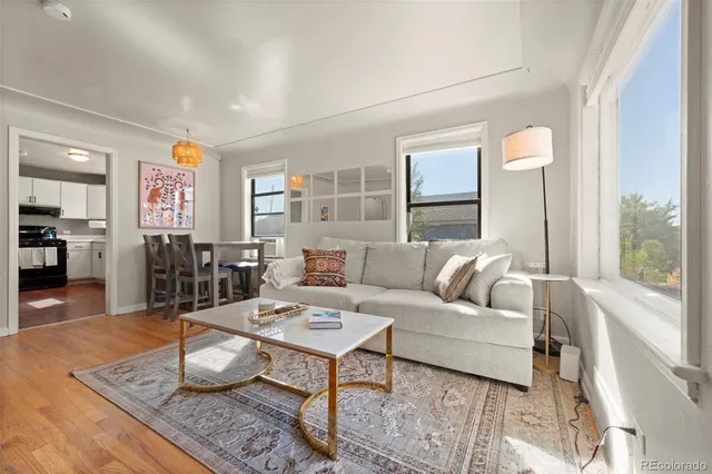 a living room with furniture and a table