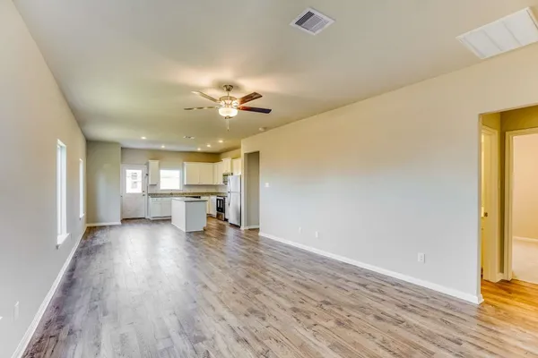 a view of a livingroom with a kitchen