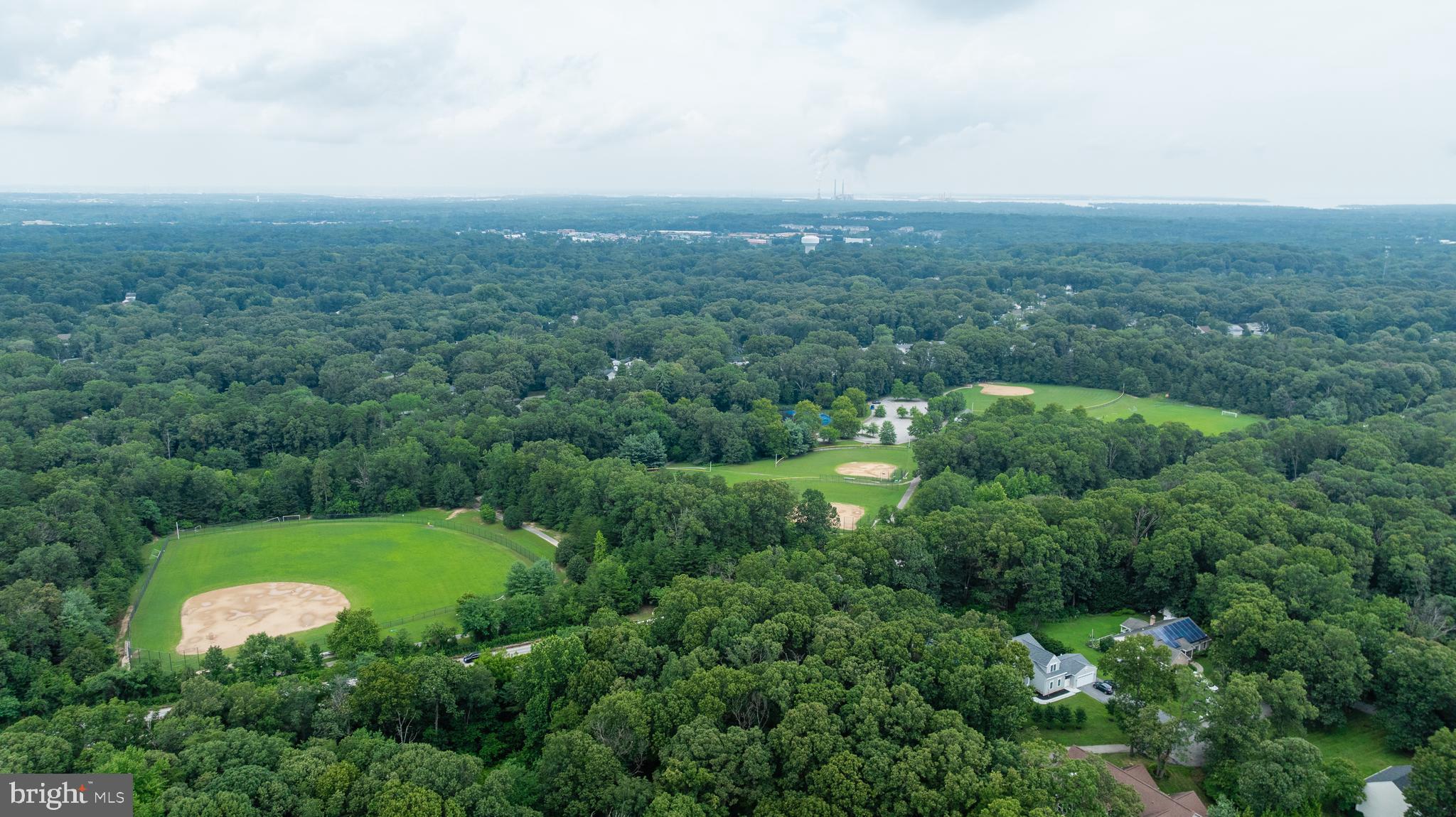 304 West Pasadena Road Millersville, MD 21108 - Photo 5 of 7 an aerial view of a house with a yard