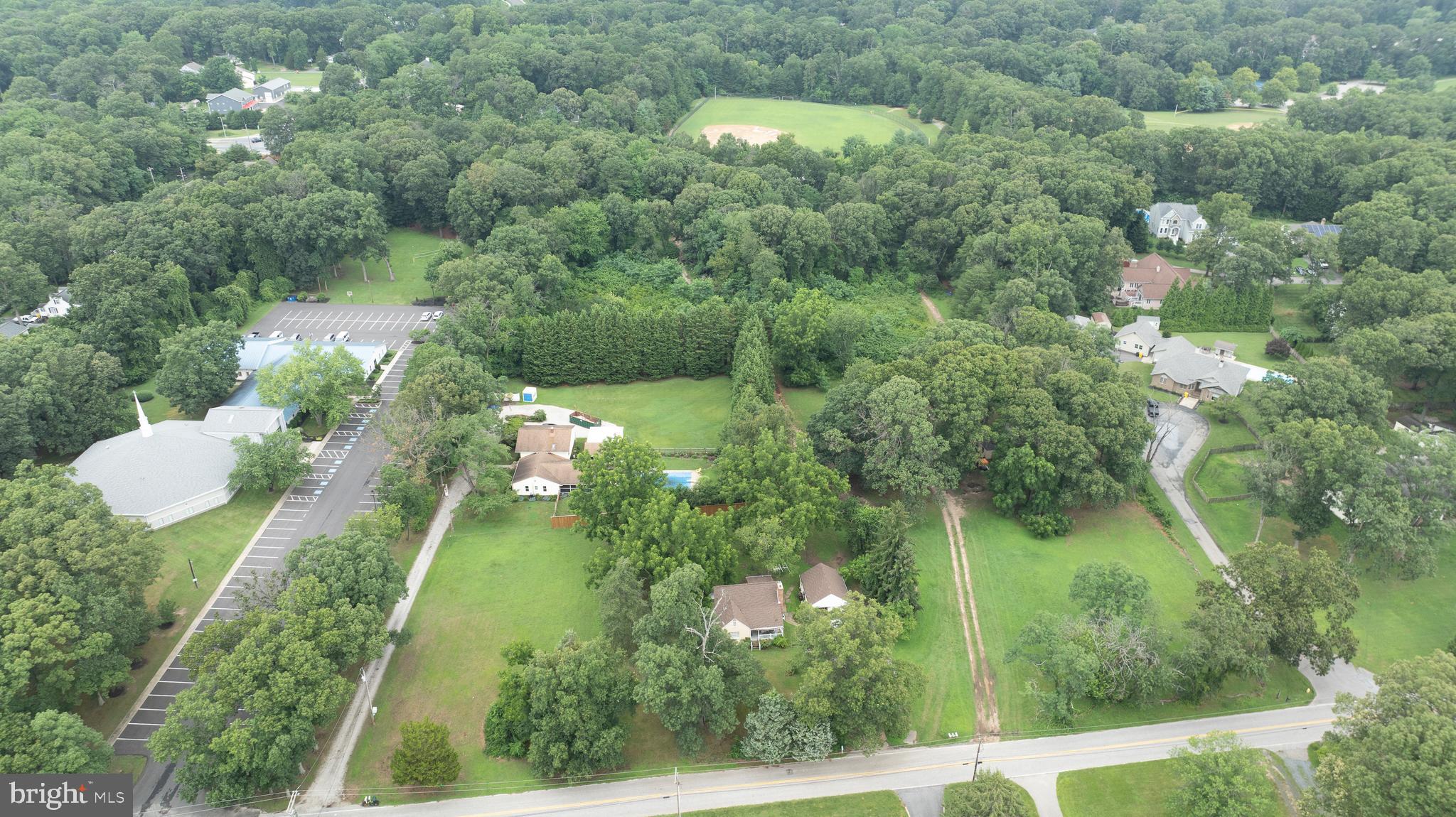 304 West Pasadena Road Millersville, MD 21108 - Photo 6 of 7 an aerial view of residential houses with outdoor space and trees
