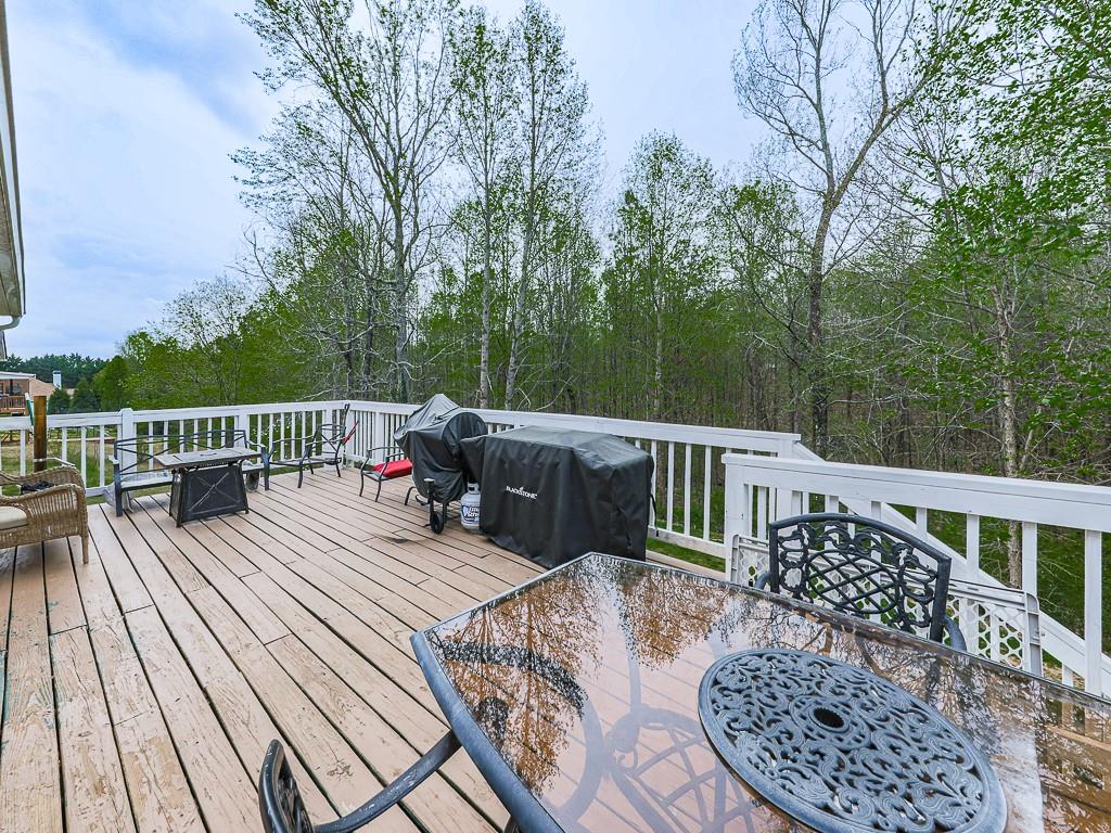 68 Arbor Hills Road South Talking Rock, GA 30175 - Photo 26 of 36 a view of a wooden deck with furniture