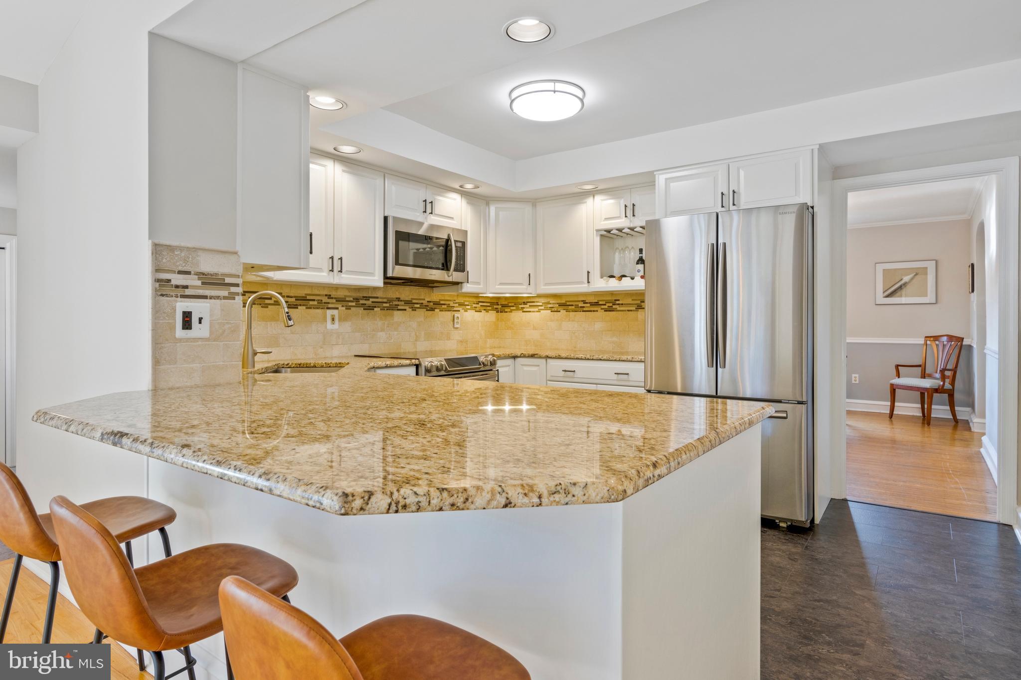 402 Briarwood Road Wallingford, PA 19086 - Photo 14 of 25 Open Kitchen w/ granite counters, tile backsplash