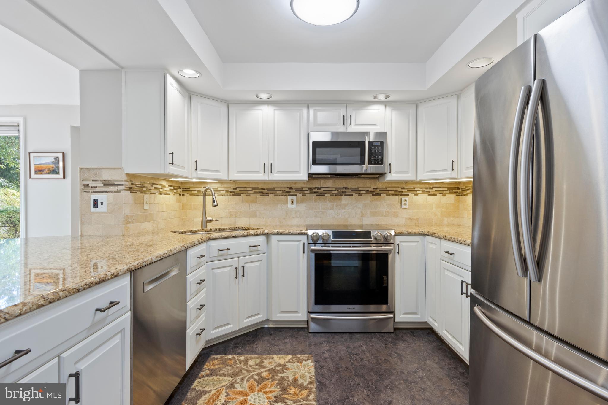 402 Briarwood Road Wallingford, PA 19086 - Photo 15 of 25 Kitchen w/ granite counters, SS appliances