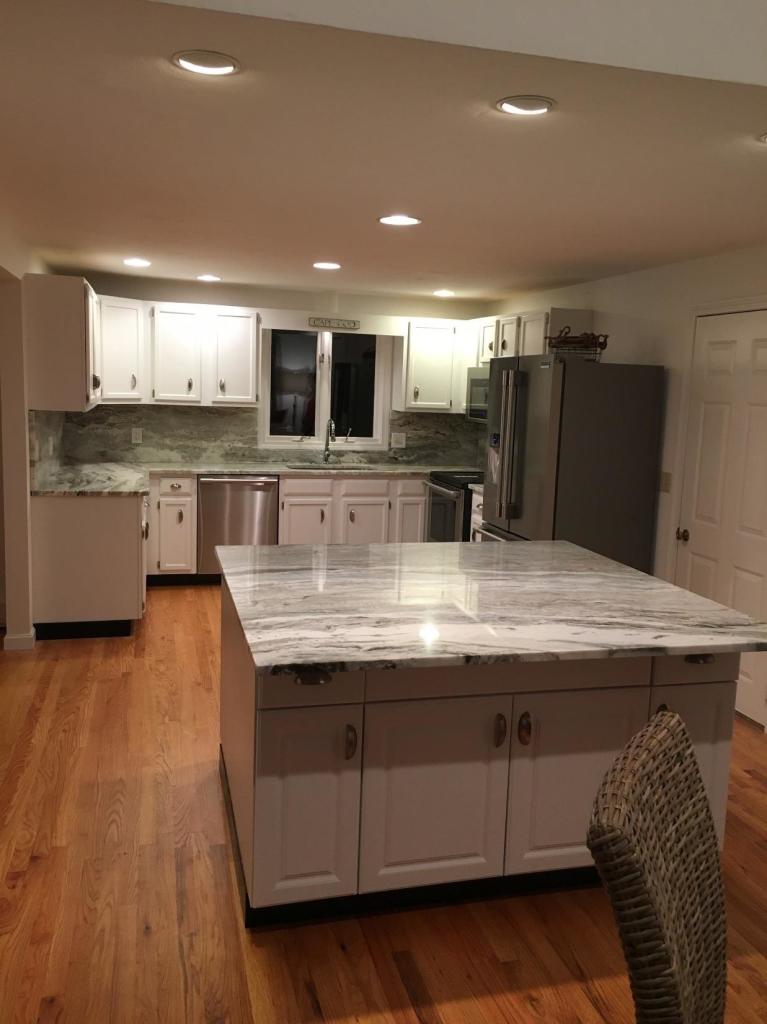 52 Spring Hill Road North Chatham, MA 02650 - Photo 16 of 33 a kitchen with stainless steel appliances granite countertop a sink dishwasher a stove and a refrigerator with wooden floor