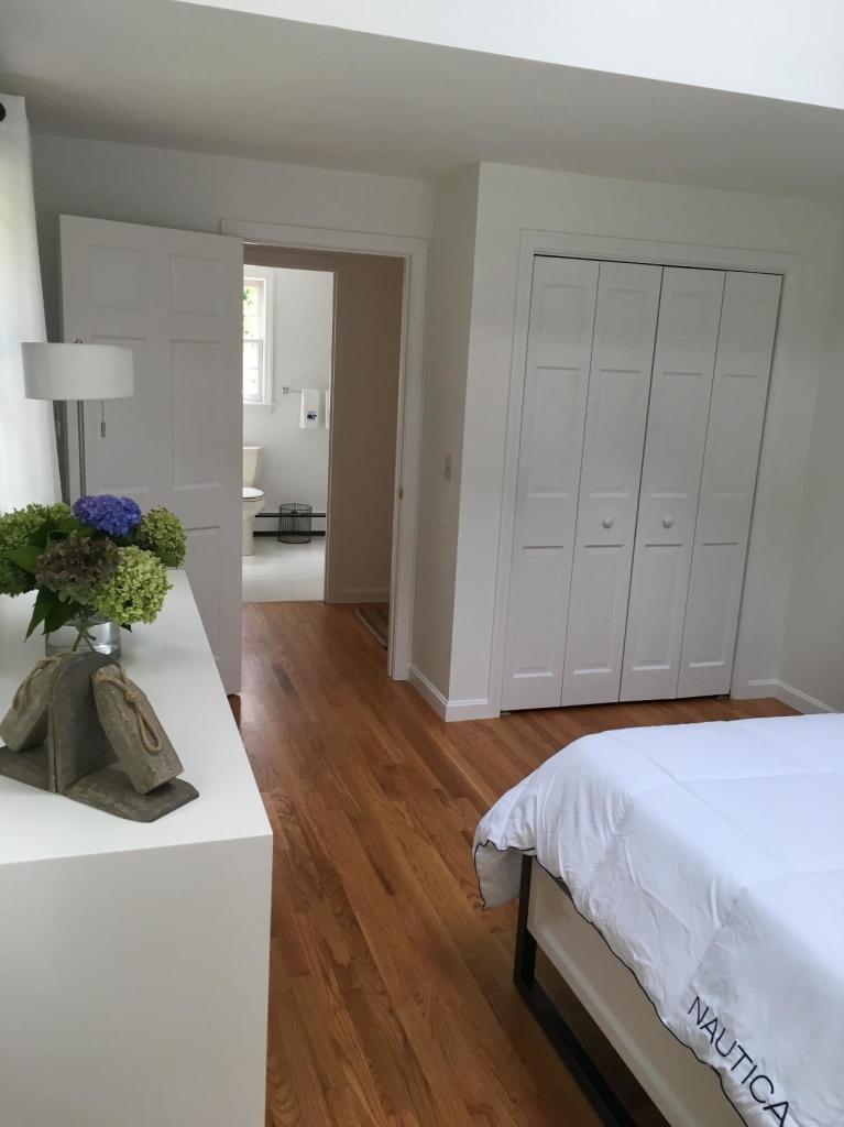 52 Spring Hill Road North Chatham, MA 02650 - Photo 27 of 33 a bedroom with a bed and a potted plant