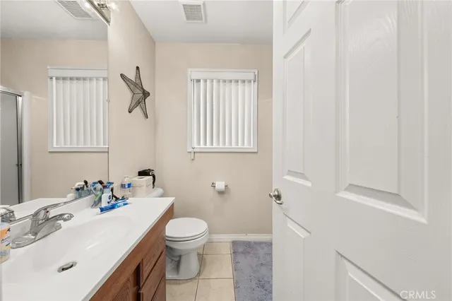 a bathroom with a sink toilet and vanity