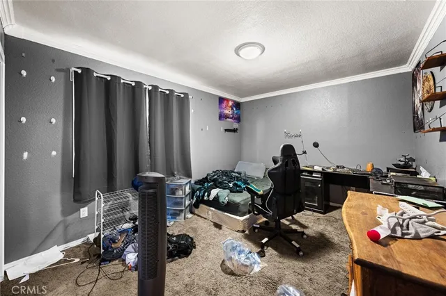 a bedroom with furniture and a closet