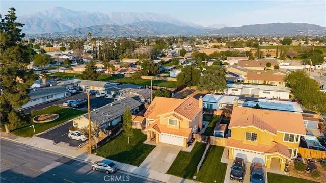 an aerial view of a house with a ocean view