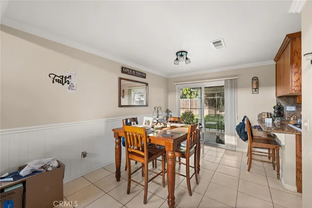 a view of a dining room with furniture and a livingroom