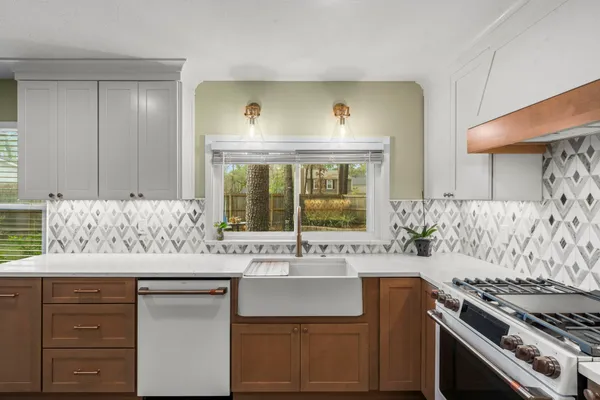 a kitchen with a stove and a sink