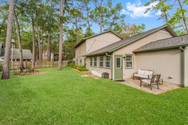 a view of a house with a backyard