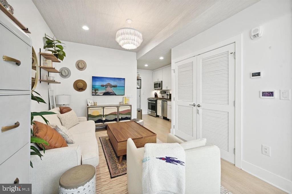 4016 Georgia Avenue Northwest, Unit 4 Washington, DC 20011 - Photo 3 of 13 a living room with furniture and a window