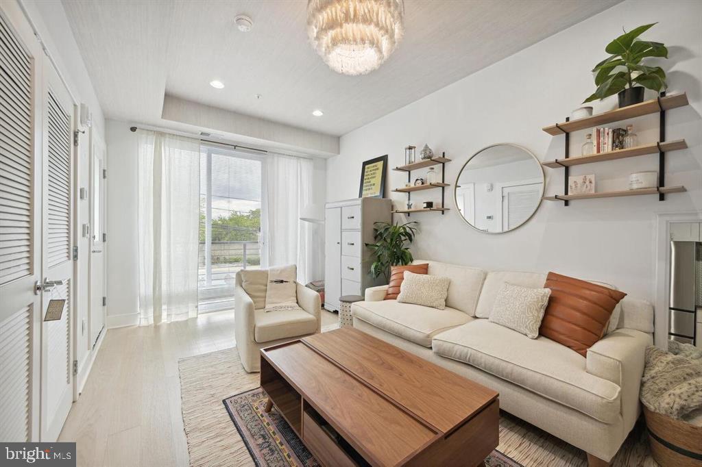 4016 Georgia Avenue Northwest, Unit 4 Washington, DC 20011 - Photo 4 of 13 a living room with furniture a rug and a window