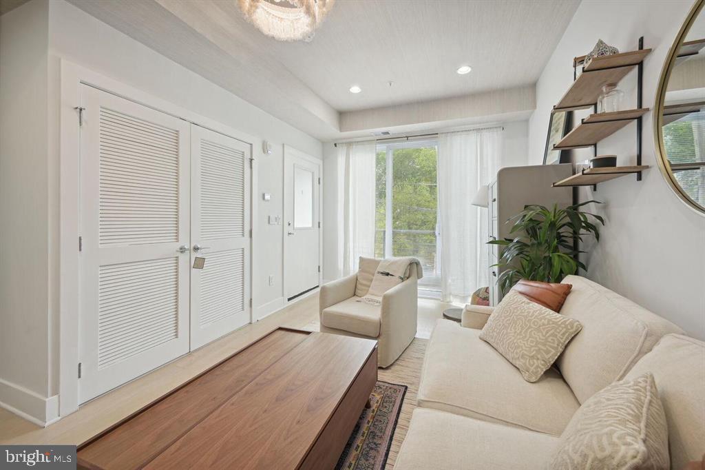 4016 Georgia Avenue Northwest, Unit 4 Washington, DC 20011 - Photo 10 of 13 a living room with furniture and a window
