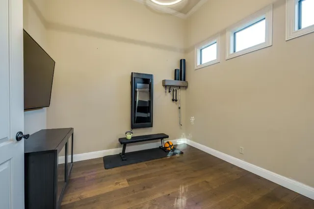 a bathroom with a sink and mirror with toilet