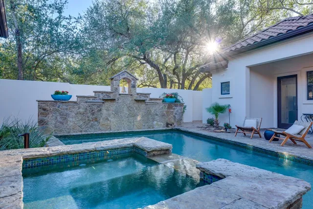 a view of a swimming pool with a patio