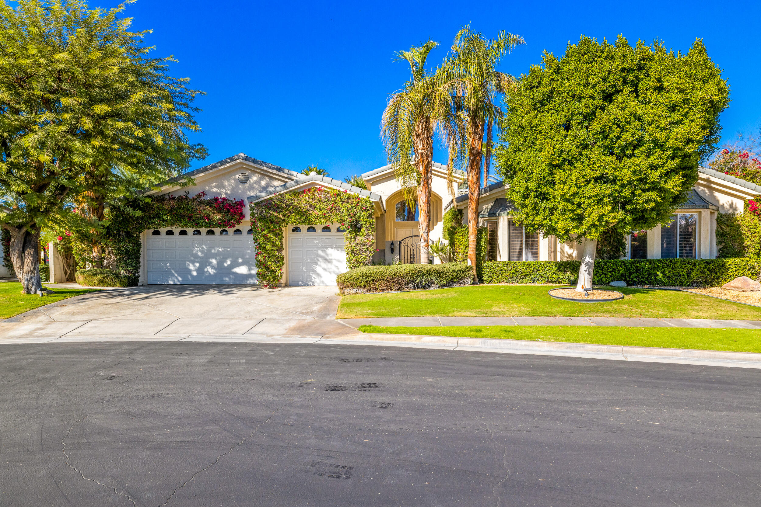 8 Trafalgar Rancho Mirage, CA 92270 - Photo 2 of 41 a view of swimming pool with a yard