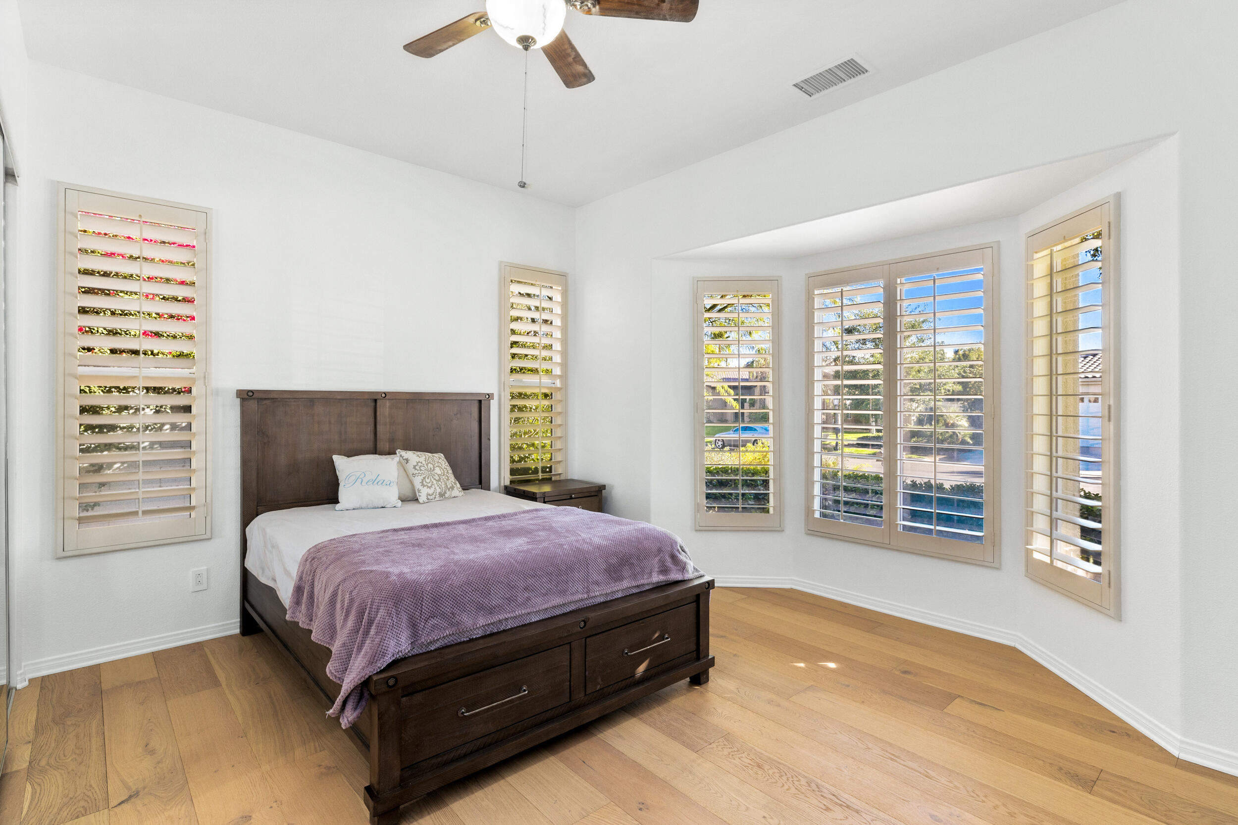 8 Trafalgar Rancho Mirage, CA 92270 - Photo 11 of 41 a bedroom with a large bed and a large window