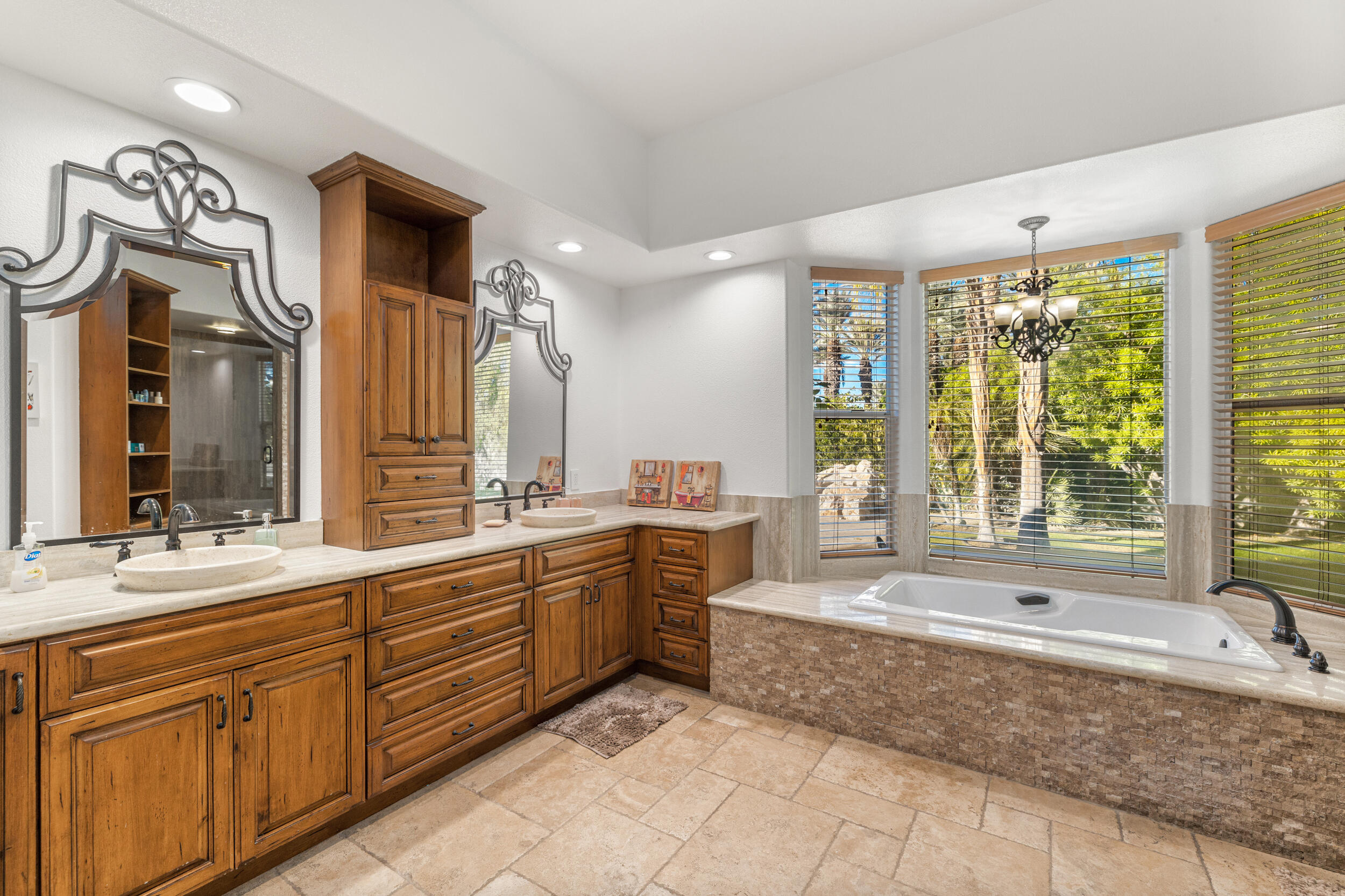 8 Trafalgar Rancho Mirage, CA 92270 - Photo 16 of 41 a large bathroom with a large tub and sink