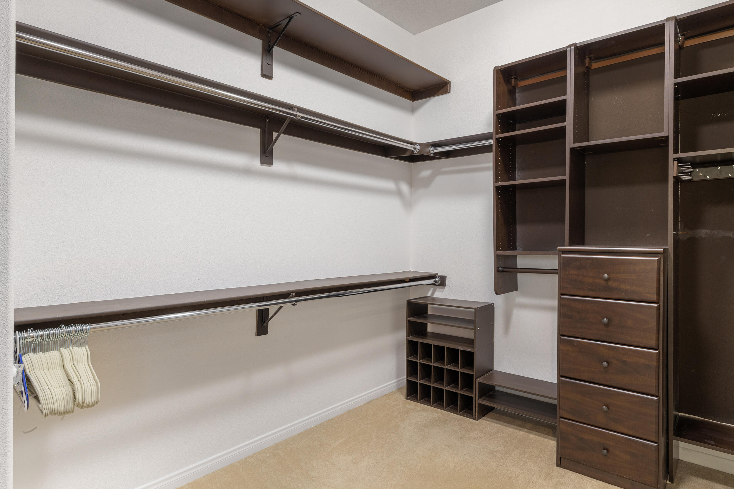 8 Trafalgar Rancho Mirage, CA 92270 - Photo 18 of 41 a view of walk in closet with clothes and shoes