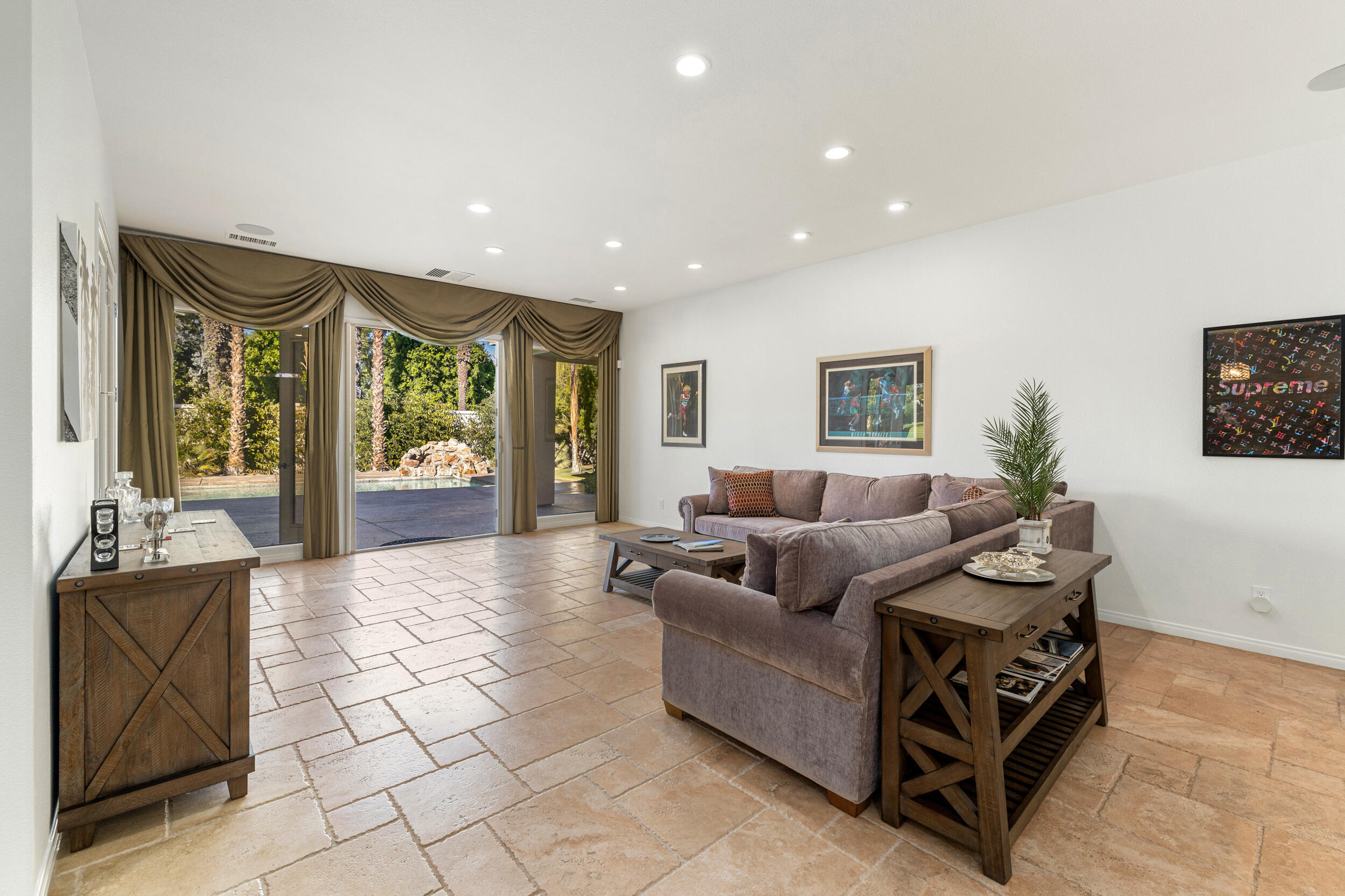 8 Trafalgar Rancho Mirage, CA 92270 - Photo 22 of 41 a living room with furniture and a large window