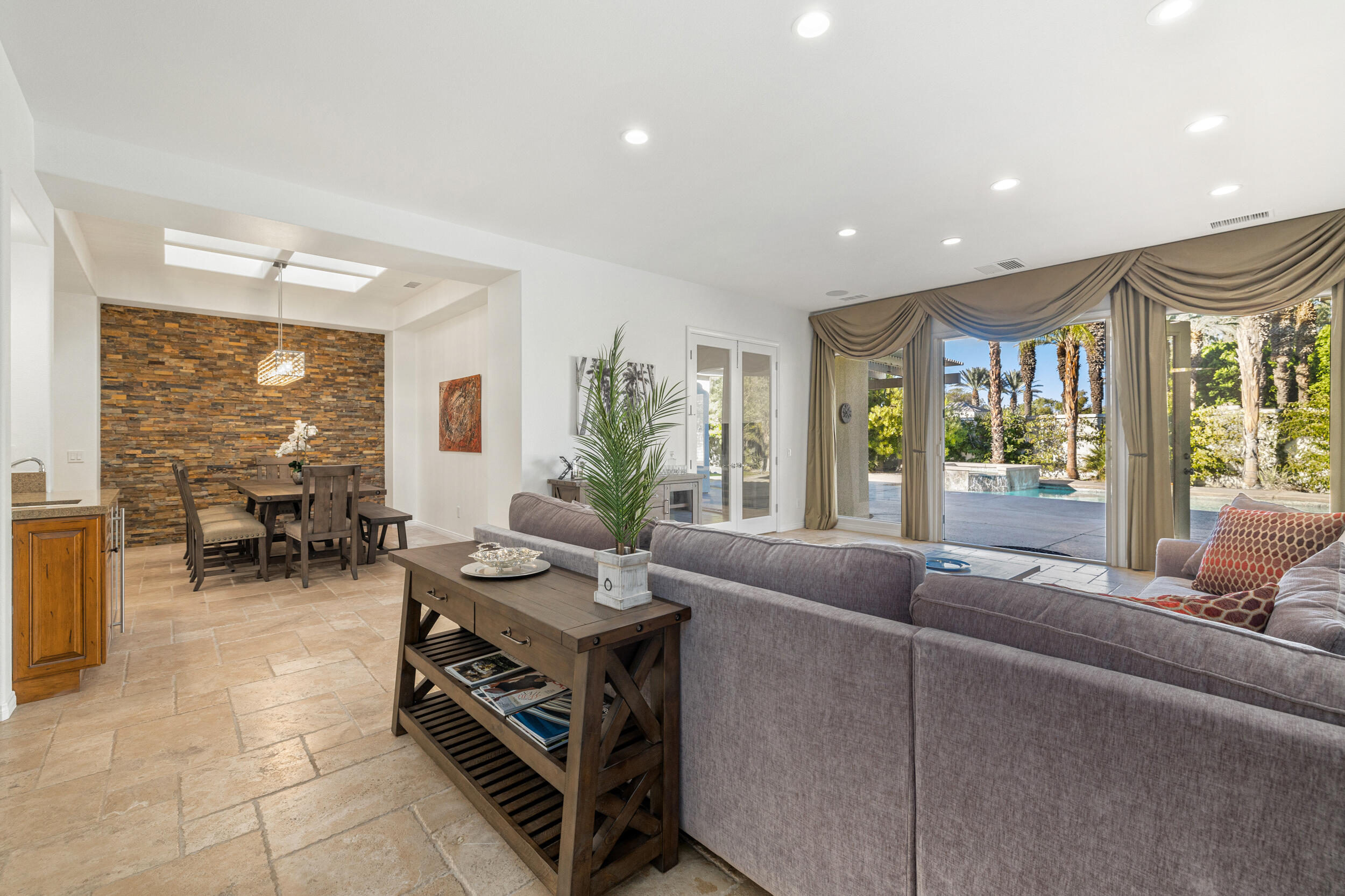 8 Trafalgar Rancho Mirage, CA 92270 - Photo 23 of 41 a living room with furniture and a large window