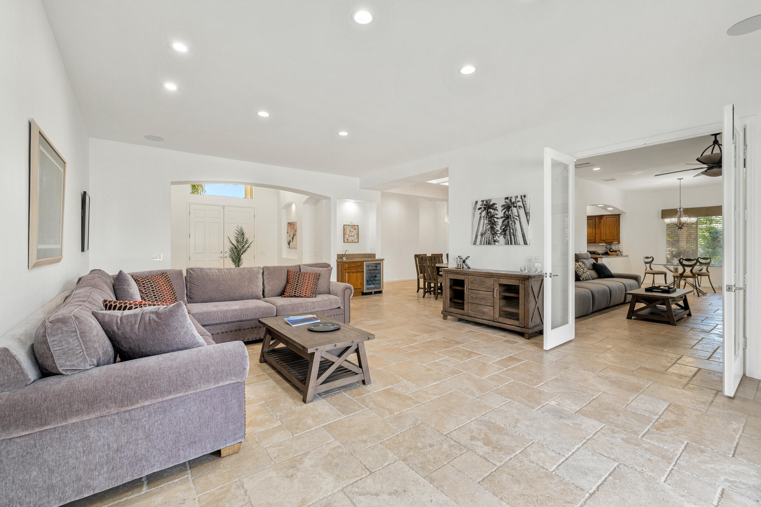 8 Trafalgar Rancho Mirage, CA 92270 - Photo 24 of 41 a living room with furniture and a flat screen tv