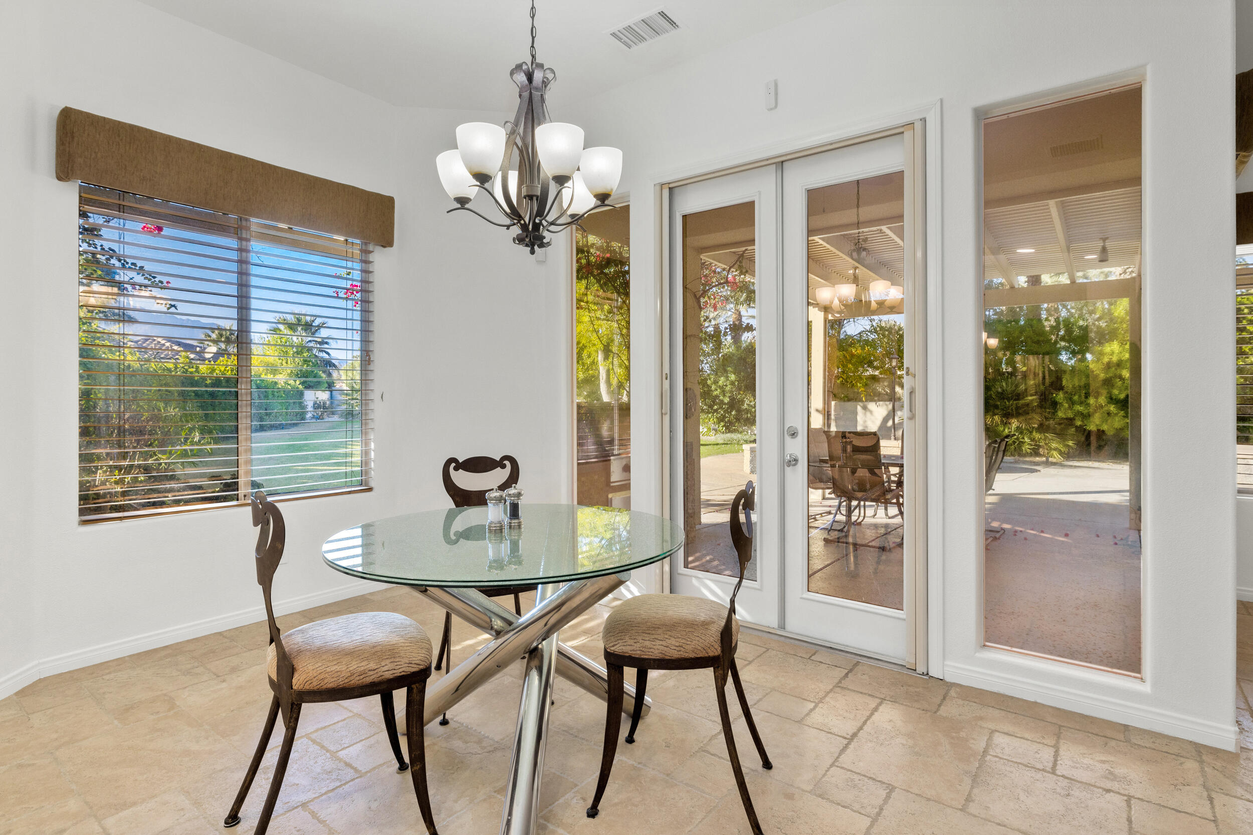 8 Trafalgar Rancho Mirage, CA 92270 - Photo 29 of 41 a dining room with furniture and window