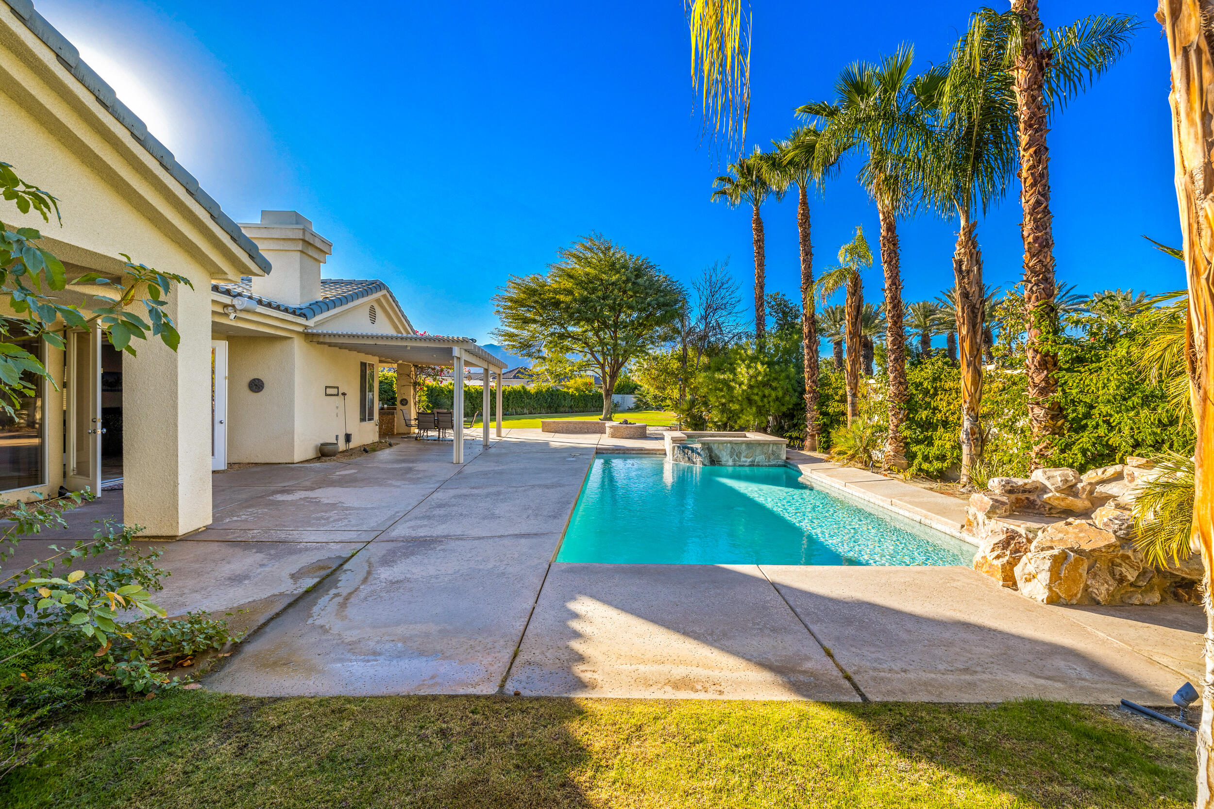 8 Trafalgar Rancho Mirage, CA 92270 - Photo 34 of 41 a view of a backyard with swimming pool